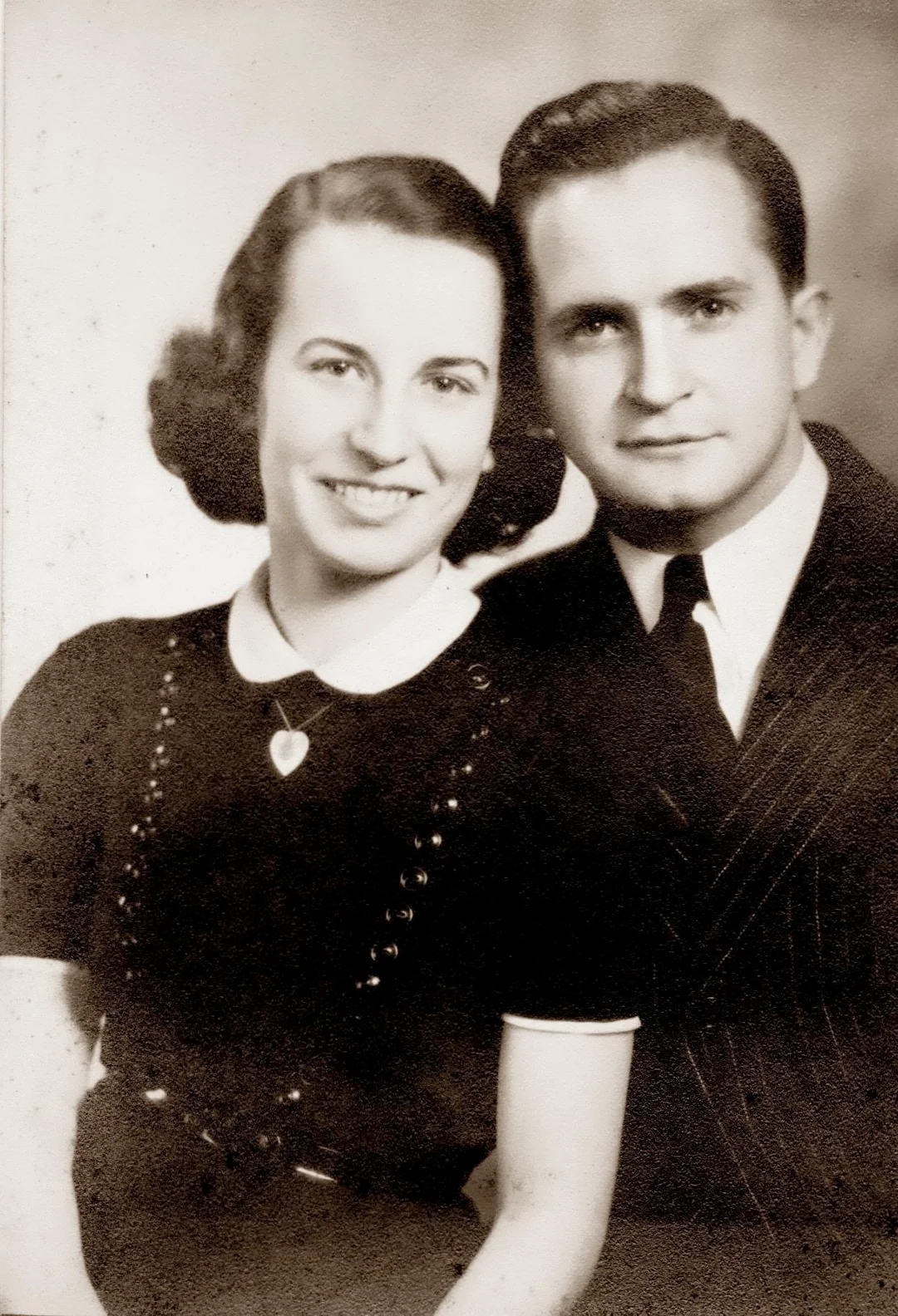 Damaged old family photo before AI restoration