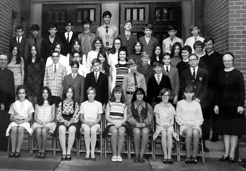 Faded vintage class photo before AI restoration